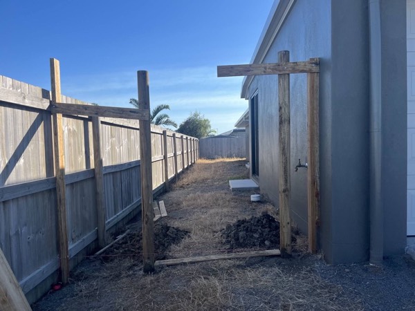 Timber fence posts and rails set in place ready for palings